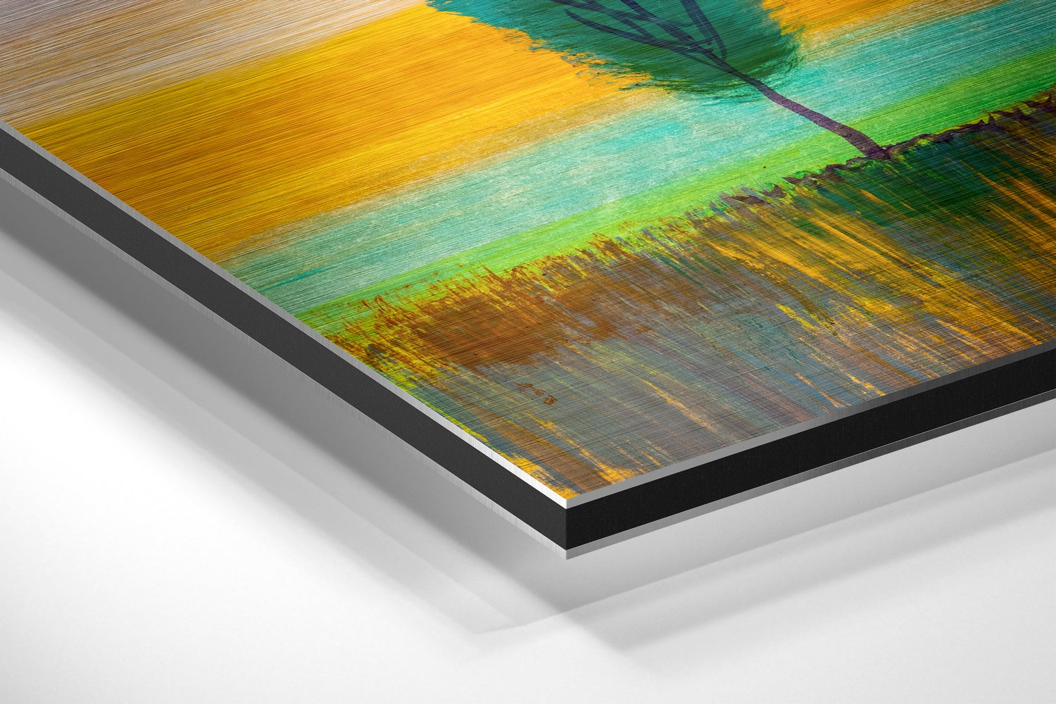 Close-up angled view of brushed aluminum dibond wall art with layered yellow, green, teal, and brown painted strokes.