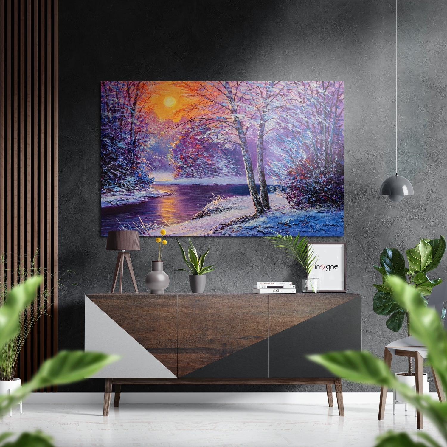 Vibrant winter landscape metal wall art depicting a snowy forest scene with purple and golden sunset over a frozen river, displayed above a wooden console table.