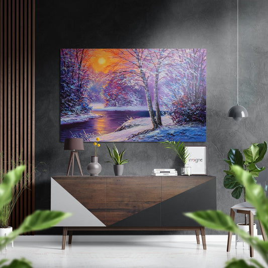 Vibrant winter landscape metal wall art depicting a snowy forest scene with purple and golden sunset over a frozen river, displayed above a wooden console table.
