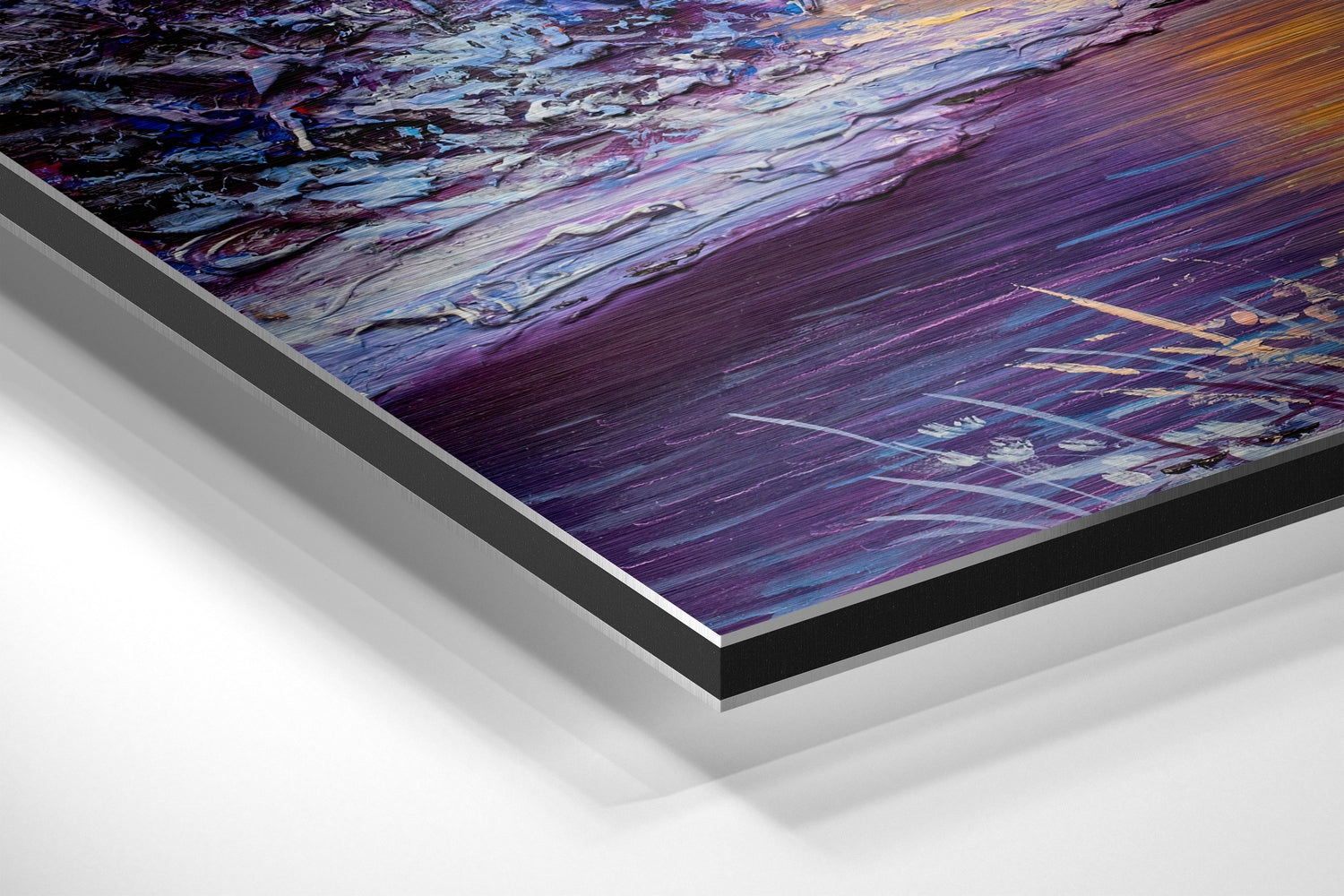 Close-up angled view of layered Dibond wall art with purple, blue, and gold brushed aluminum surface showing abstract flowing patterns.