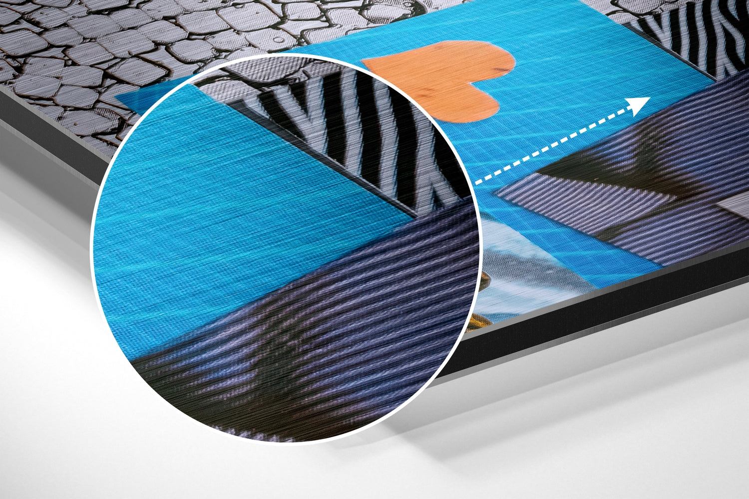 Close-up detail of blue brushed aluminium surface with layered dark striping and orange patchwork element visible on angled wall art.