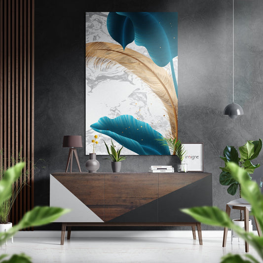 Teal leaf wall art displayed above wooden dresser in modern interior with gray textured walls and potted plants.