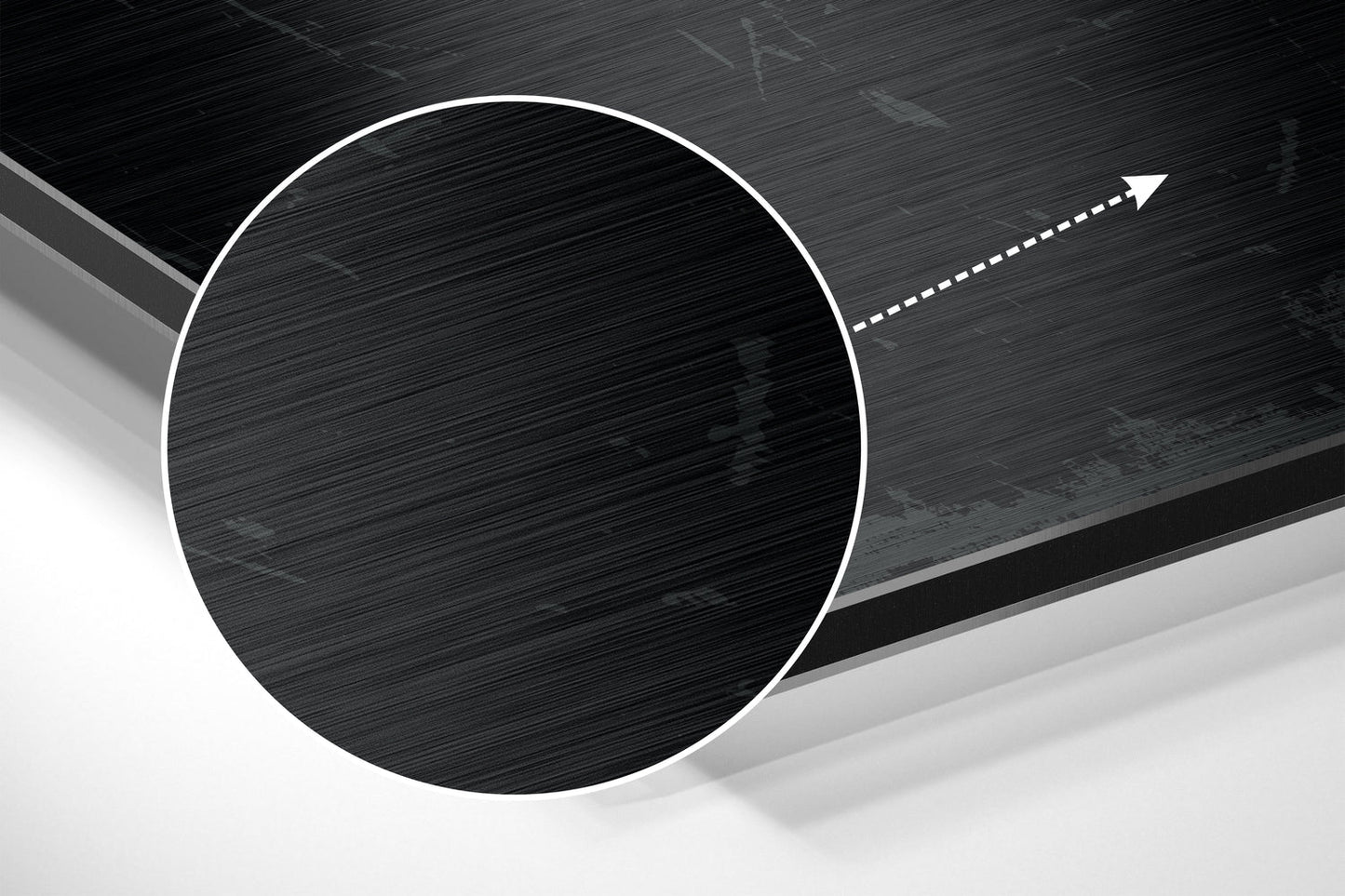 Close-up angled view of brushed aluminum Dibond wall art showing a white-outlined circle with directional arrow on dark textured background.