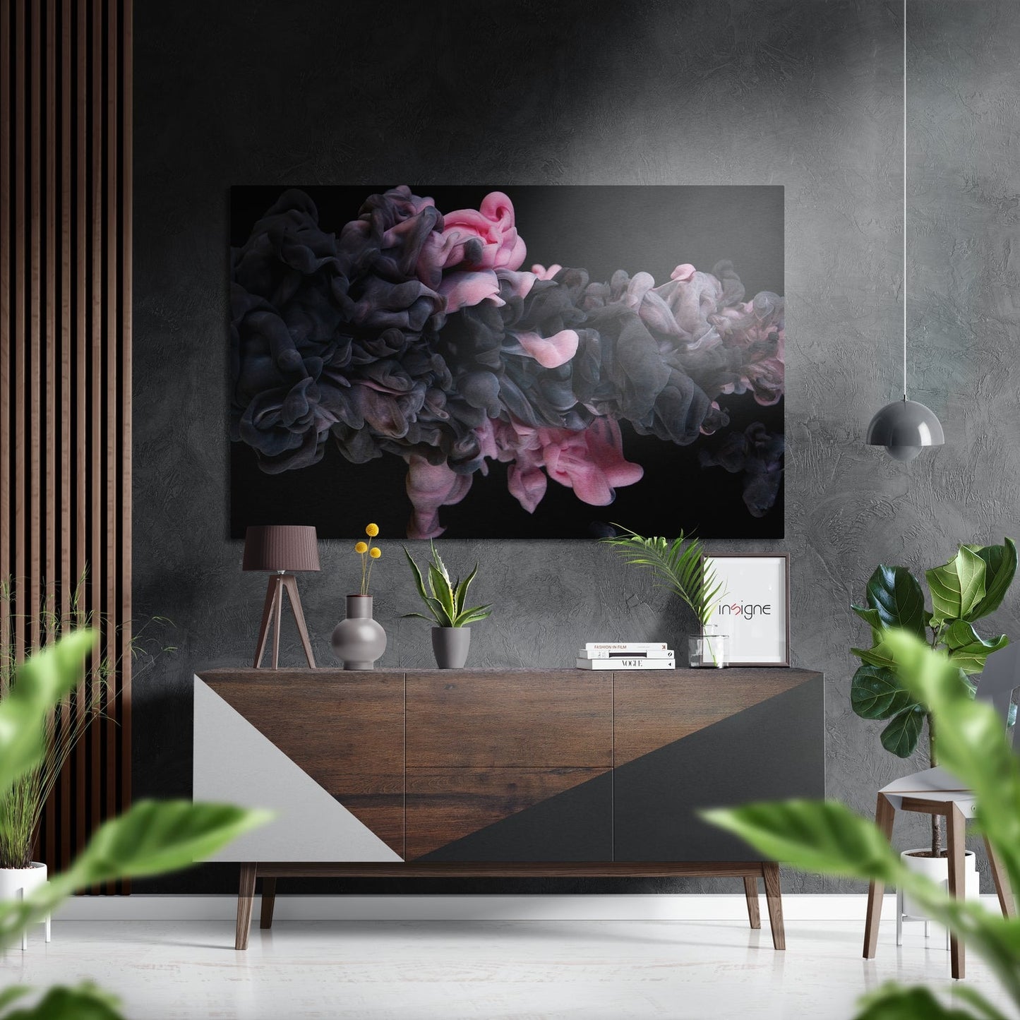 Modern living room interior with "Pinky Fume" abstract ink swirl wall art in pink, gray, and black mounted above wooden credenza.