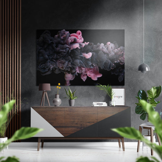 Modern living room interior with "Pinky Fume" abstract ink swirl wall art in pink, gray, and black mounted above wooden credenza.