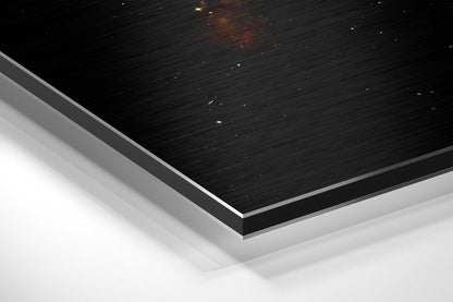 Close-up angled view of layered black brushed aluminum and white surface with embedded gold accent lights.