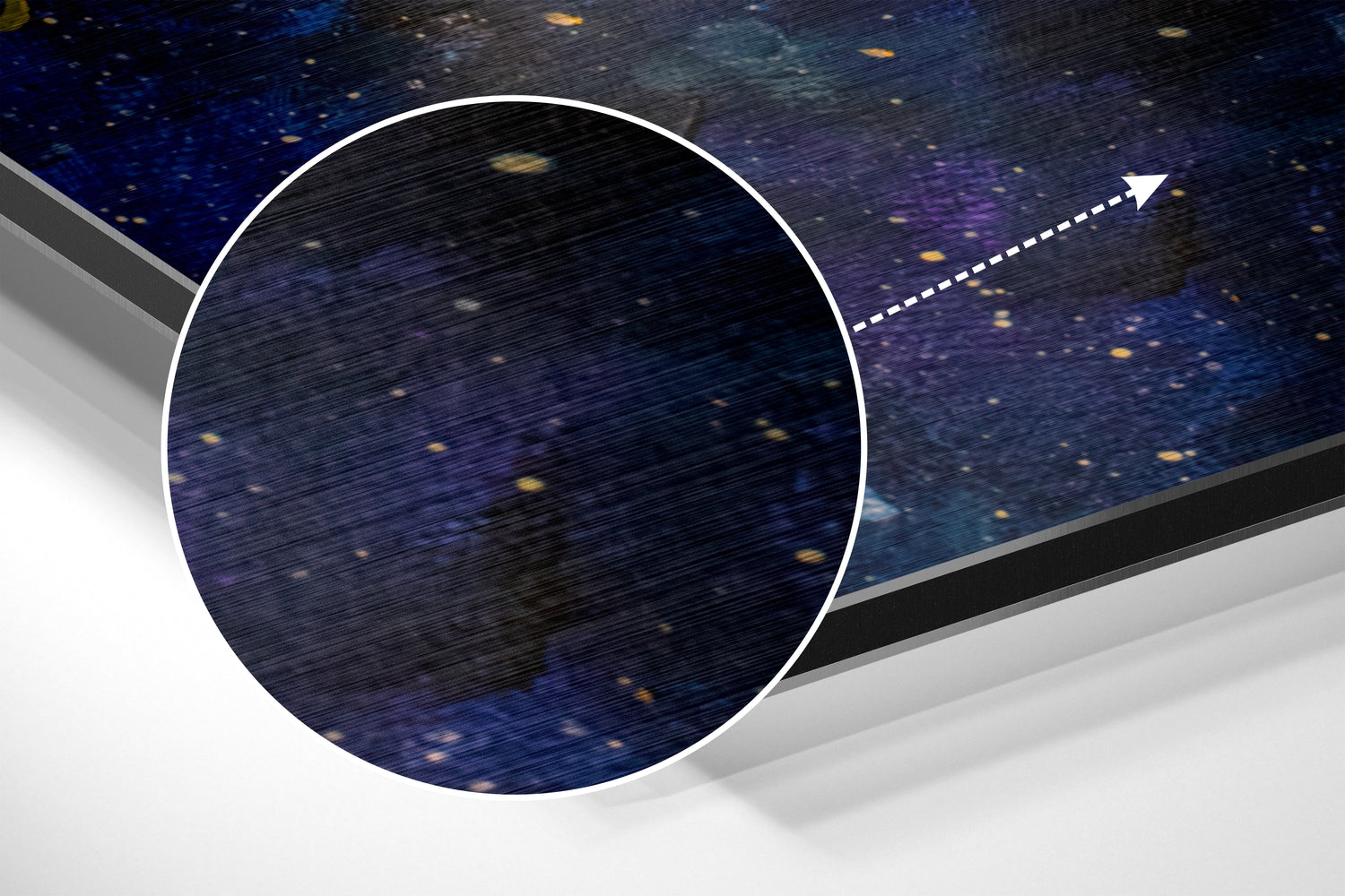 Angled view of circular Moonfall wall art showing starry night sky with white border and directional arrow pointer against gray surface.