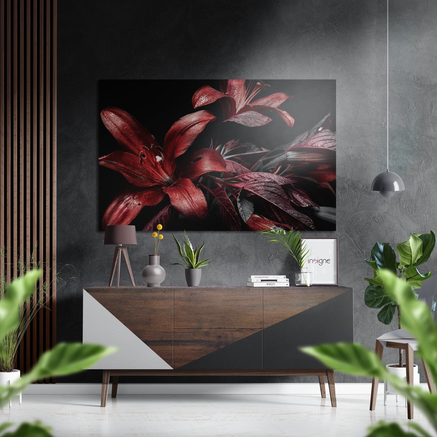 Red lily Dibond wall art displayed above a wooden console table in a modern interior setting with plants and pendant lighting.