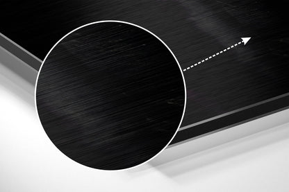 Abstract 3D composition featuring a brushed black circular disc with white outline against layered gray and white geometric planes with directional arrow.