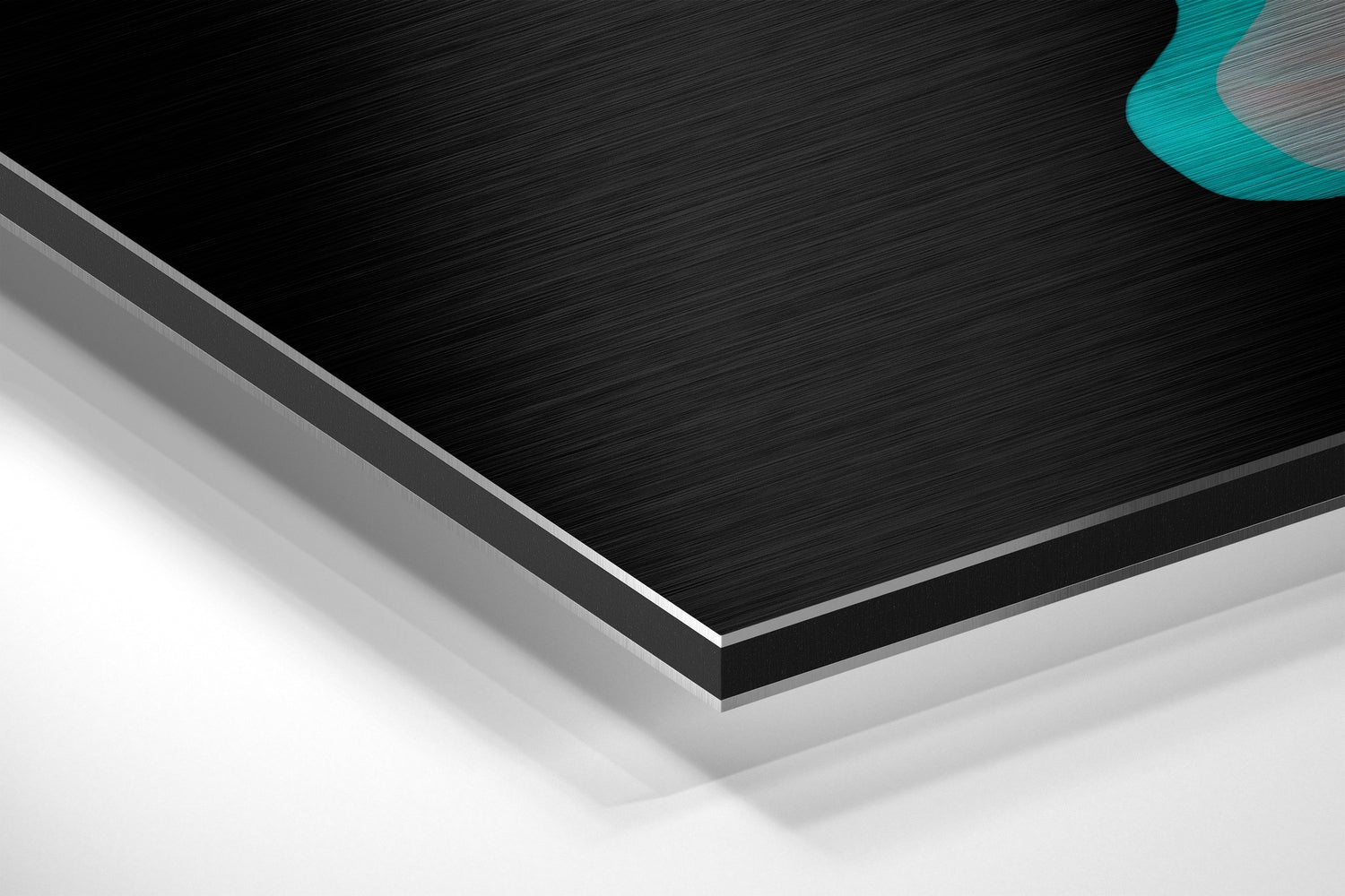Layered edge detail of brushed black aluminum dibond panel with gray and white base layers, turquoise accent visible top right.