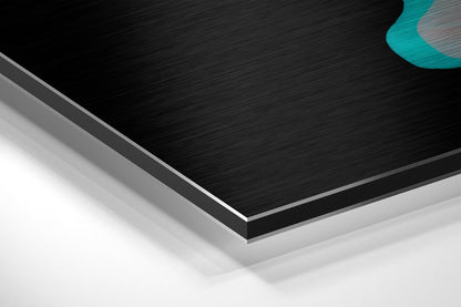 Layered edge detail of brushed black aluminum dibond panel with gray and white base layers, turquoise accent visible top right.