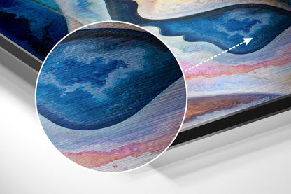 Close-up detail of brushed aluminum wall art showing layered blue, pink, and orange striations with magnified circular inset highlighting texture.