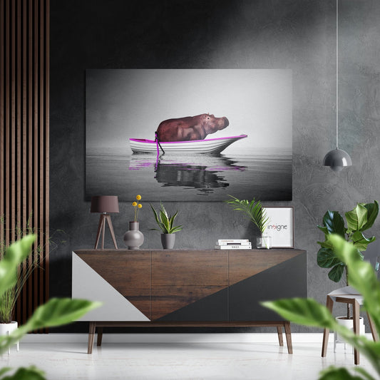 Modern interior setting displaying hippo boat artwork on gray textured wall above wooden dresser with plants and decor.