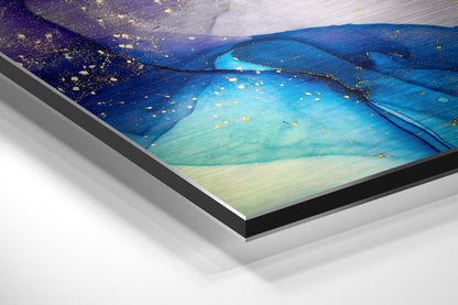 Angled close-up of framed wall art showing purple, blue, and turquoise gradient with gold accents on brushed aluminum, white mounting visible.