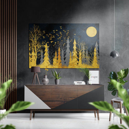 Golden forest wall art with moon and birds displayed above wooden dresser in modern interior setting.