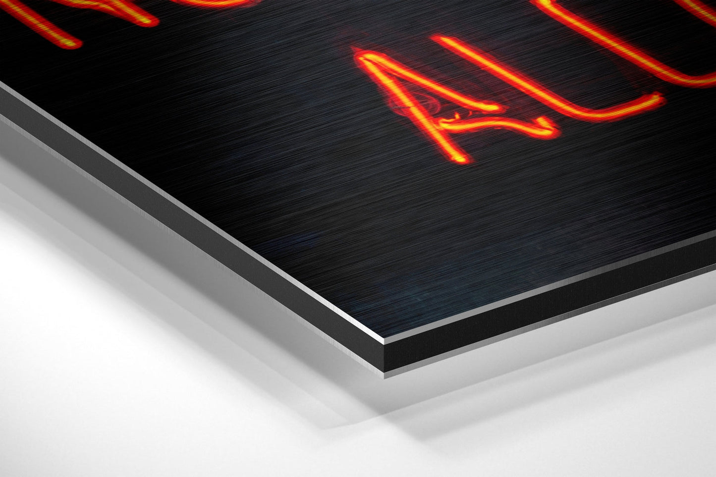 Angled perspective view of brushed aluminum Dibond panel with neon red and yellow "No Drugs" text glowing against dark textured surface.