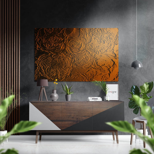 Copper embossed roses relief artwork displayed above a wooden sideboard in a modern interior with gray walls and potted plants.