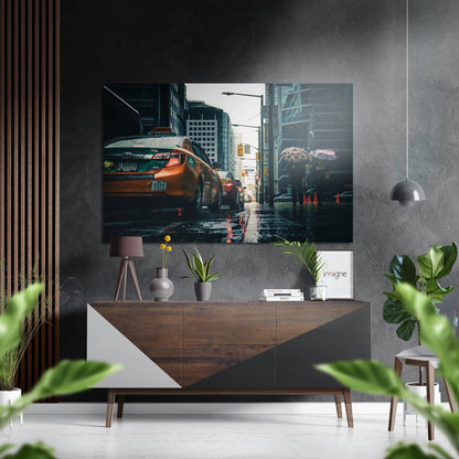 City Rush Brushed Aluminium Dibond Wall Art displaying orange taxi on wet urban street mounted above wooden console in modern interior.