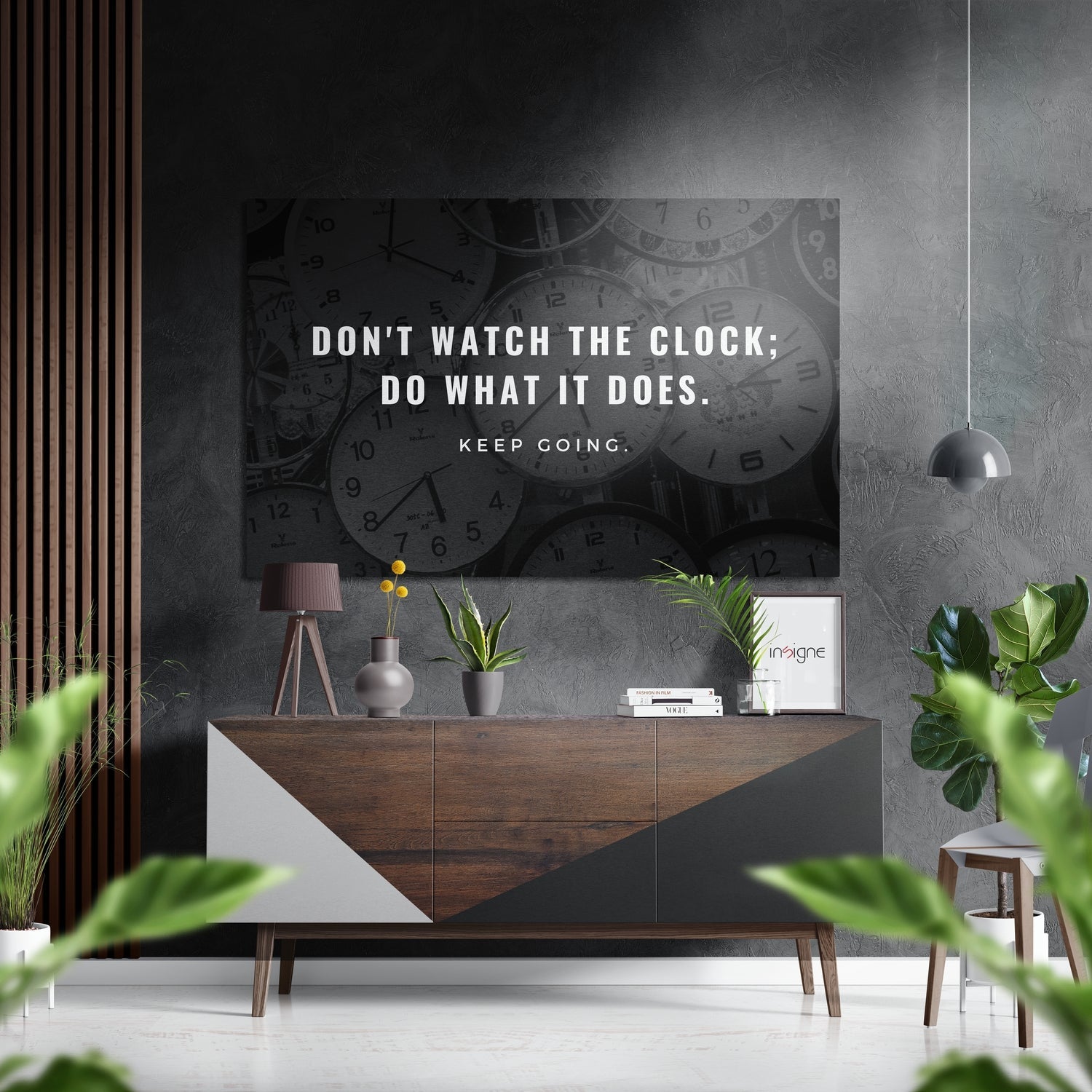 Modern living room displaying "Don't Watch the Clock; Do What It Does. Keep Going" motivational wall art above wooden credenza with plants and decor.