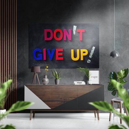 Modern interior featuring red, blue, and yellow "DON'T GIVE UP" neon-style wall art above wooden console table with plants.