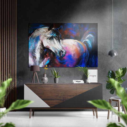 Modern interior room with colorful abstract horse artwork displayed above wooden console table with plants and accessories.
