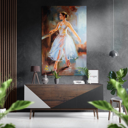 Oil painting of a ballerina in white tutu and pointe shoes displayed above a wooden console table in a modern interior setting.