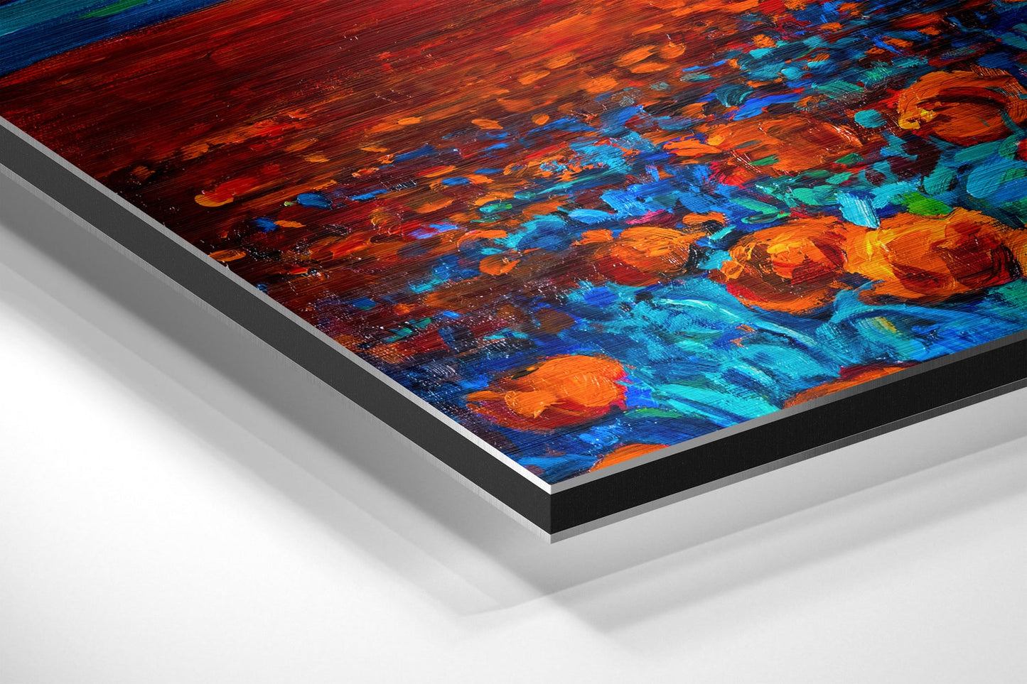 Angled view of vibrant poppy field painting on brushed aluminium Dibond with layered edge detail, showing orange, blue, and teal brushstrokes.