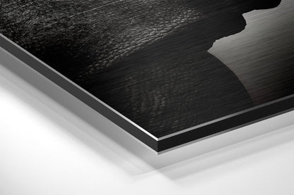 Close-up angled view of layered Dibond wall art showing brushed black aluminum surface with white backing layers against white background.