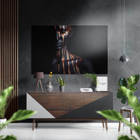 Modern living room interior featuring brushed aluminium dibond wall art of woman's face with gold striping displayed above wooden console table.