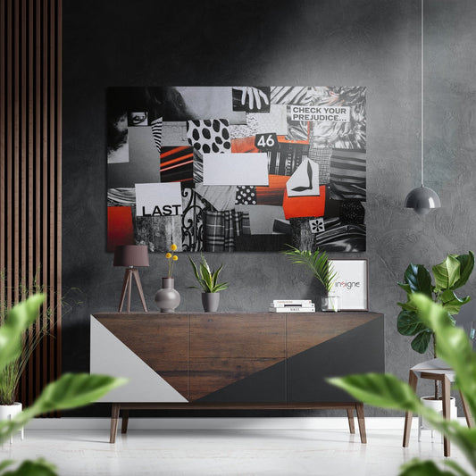 Red and black magazine collage wall art displayed above a wooden dresser in a modern gray interior with plants and pendant lighting.