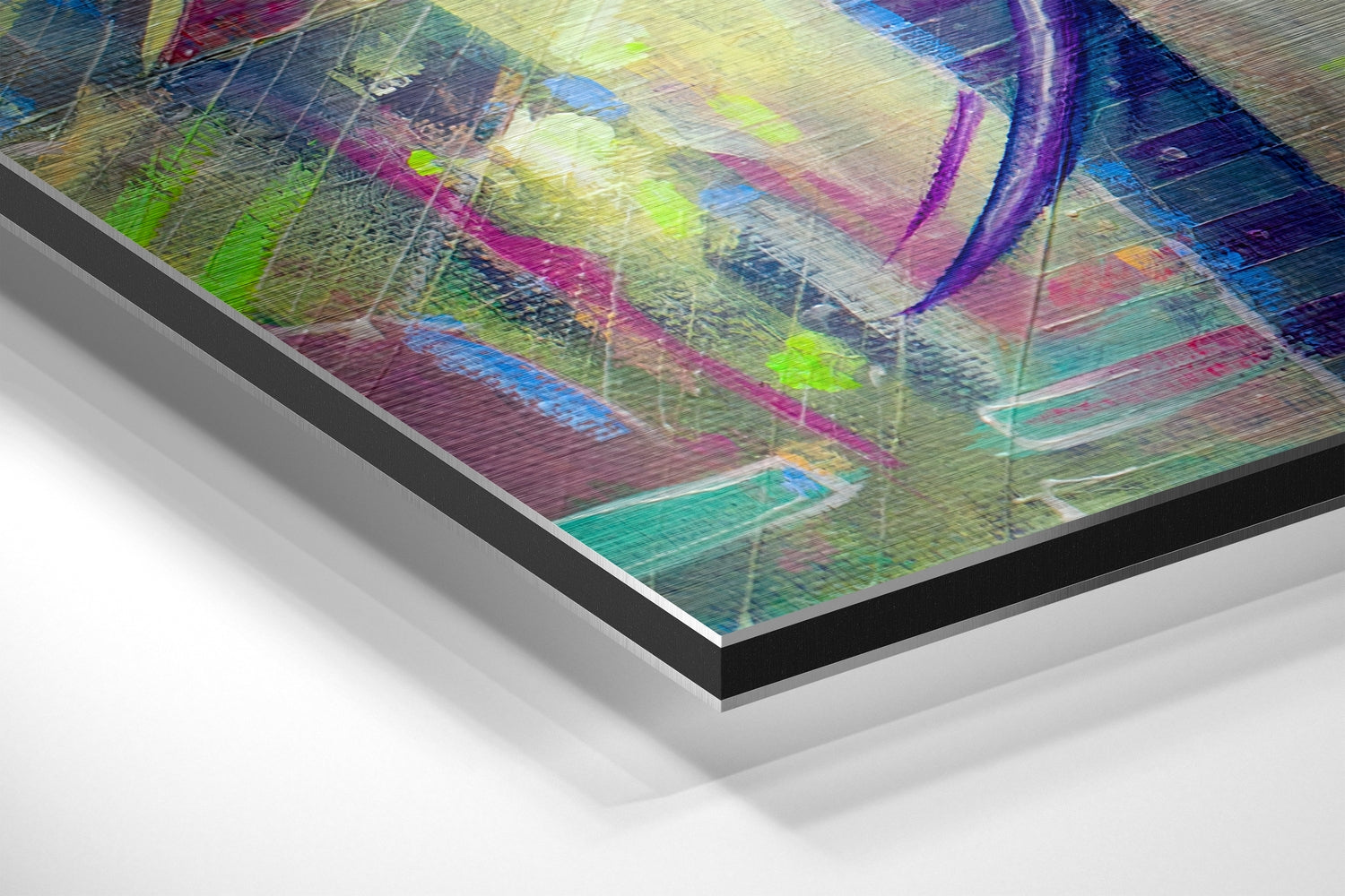 Angled close-up view of layered aluminum dibond wall art showing vibrant multicolored abstract brushstrokes in purple, green, blue, and pink with visible material edges.