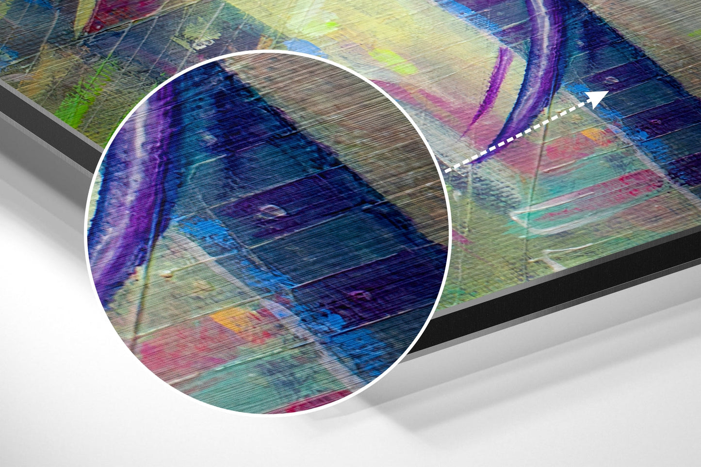 Close-up detail of brushed aluminium surface showing vibrant purple, blue, green, and pink abstract brushstrokes with horizontal texture lines.