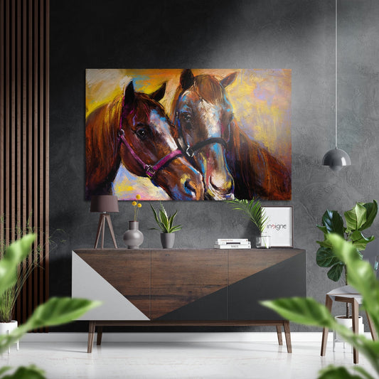 Colorful abstract horse portrait with purple halter displayed above wooden console table in modern gray interior with plants and pendant light.