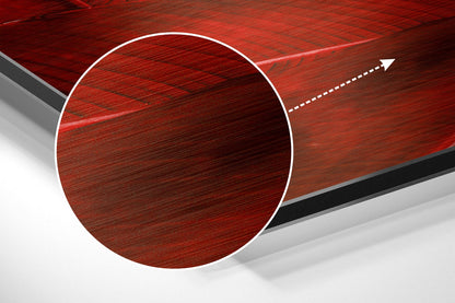 Red brushed aluminium circular design with white border and directional arrow on angled perspective background.