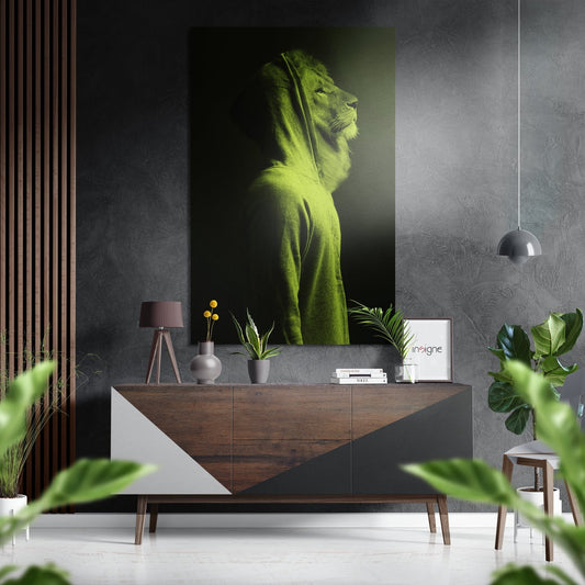 Lime green lion portrait artwork displayed on dark textured wall above wooden sideboard in modern interior setting.