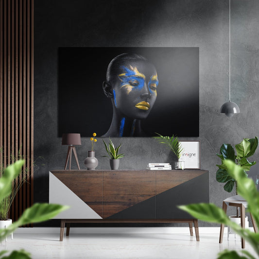 Modern interior display featuring black body paint art with blue and gold accents on aluminium panel above wooden sideboard.