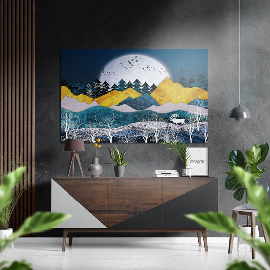 Modern interior with gold and teal layered mountain landscape artwork featuring white moon and birch trees above wooden console table with decor.