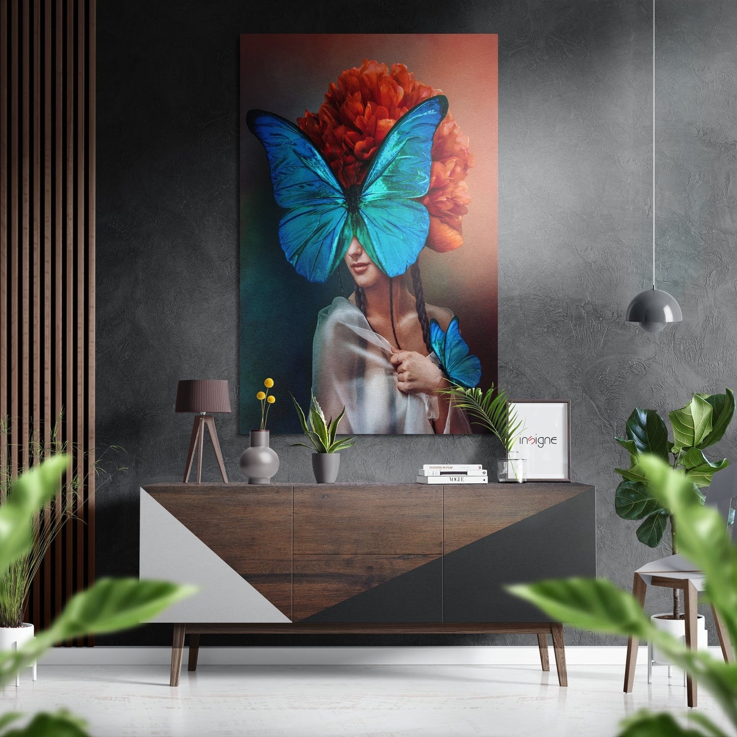 Modern interior display showing Butterfly Eyes metal wall art hung above a wooden dresser with potted plants and decorative objects.