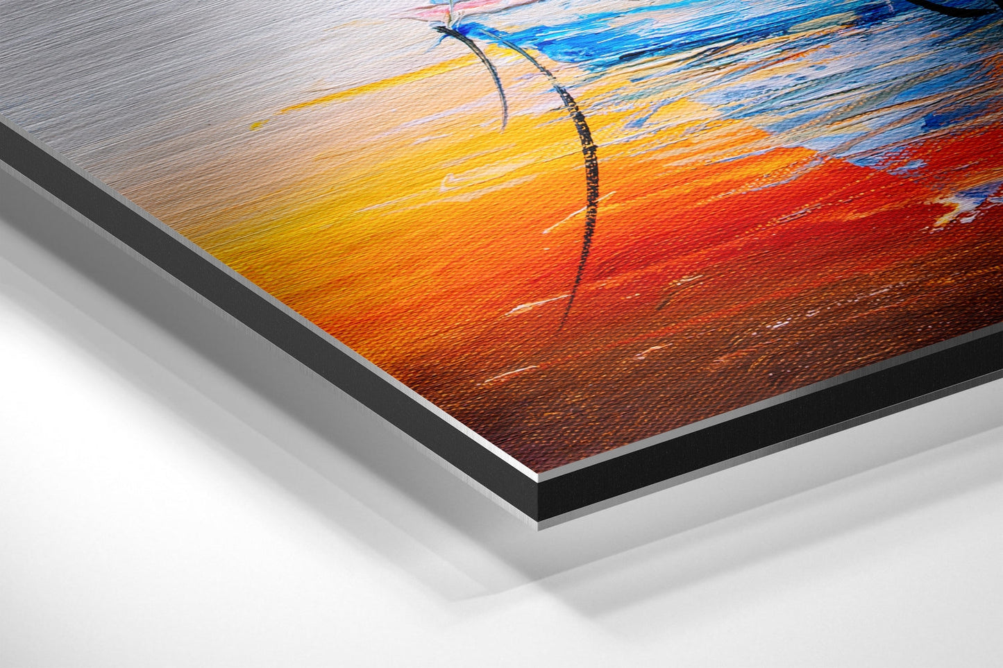 Close-up angled view of brushed aluminium Dibond wall art featuring a colorful boat with yellow, orange, red, and blue tones against textured surface.
