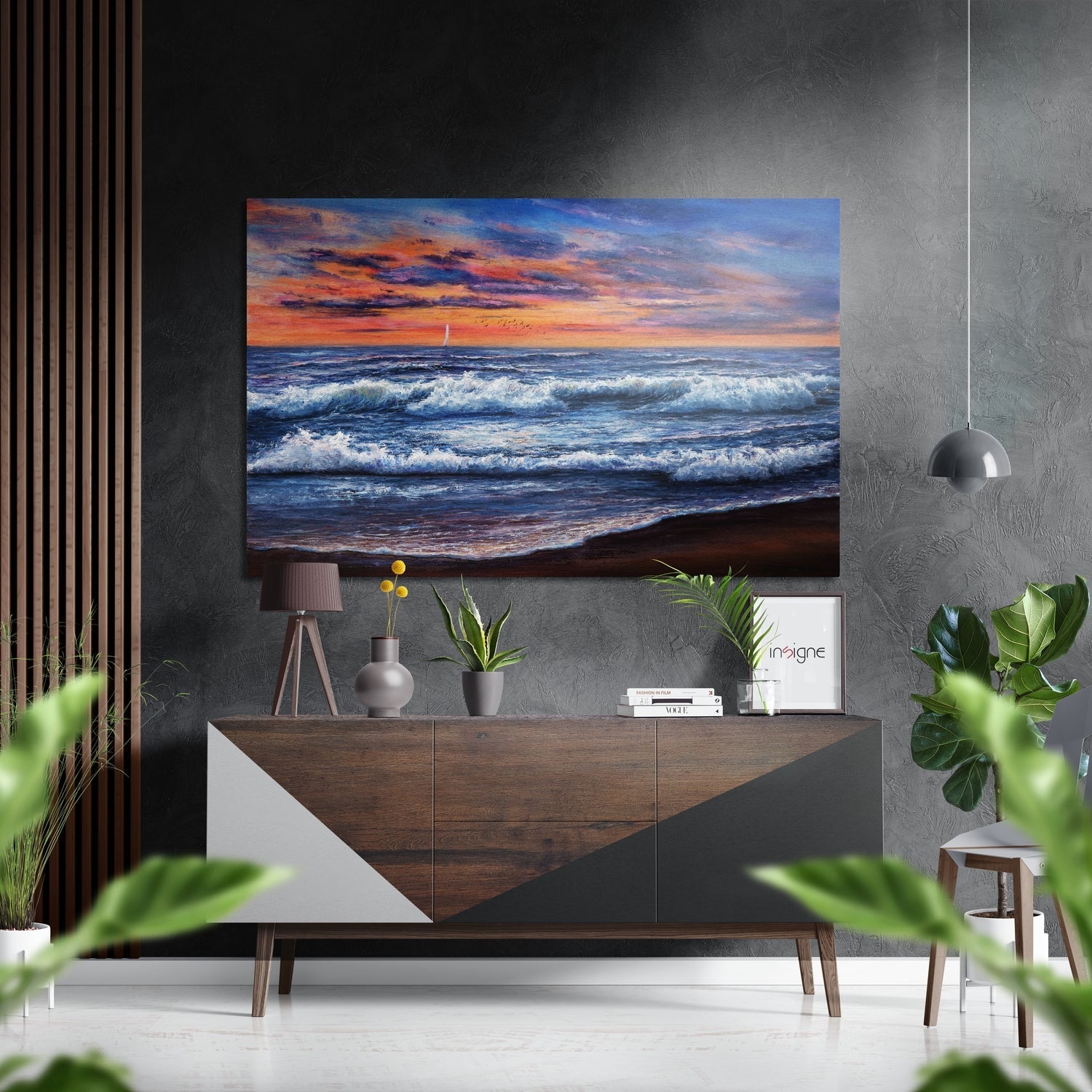 Coastal sunset seascape with orange sky and white-capped waves displayed on aluminum wall above wooden console in modern interior.