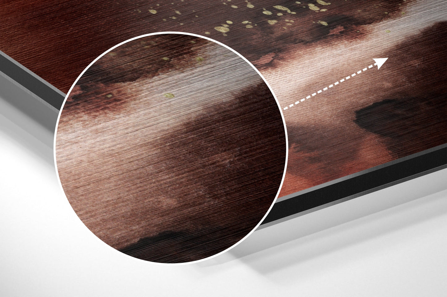 Close-up detail of brushed aluminum dibond showing wood grain texture in deep brown and tan tones with directional arrow indicator.