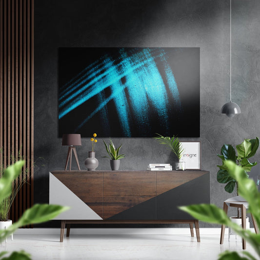Modern living room with turquoise brushstroke abstract art displayed above wooden console table with decorative accessories.