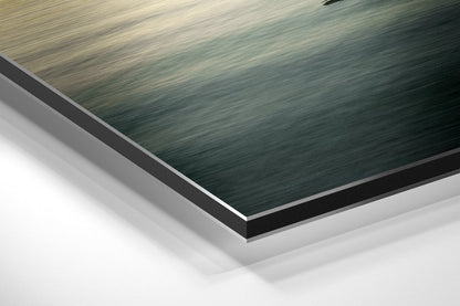 Close-up angled view of layered Dibond wall art showing brushed aluminum surface in teal and gray with white backing board visible.