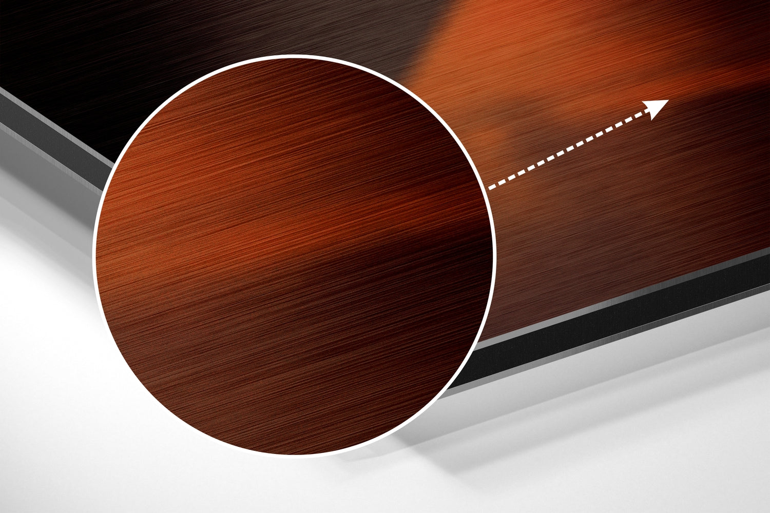 Brown circular brushed metal disc with white border on angled wooden and gray background with white directional arrow.