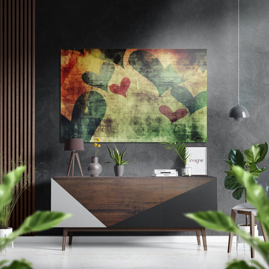 Modern interior with geometric hearts artwork in warm and cool tones displayed above wooden console table with decor.