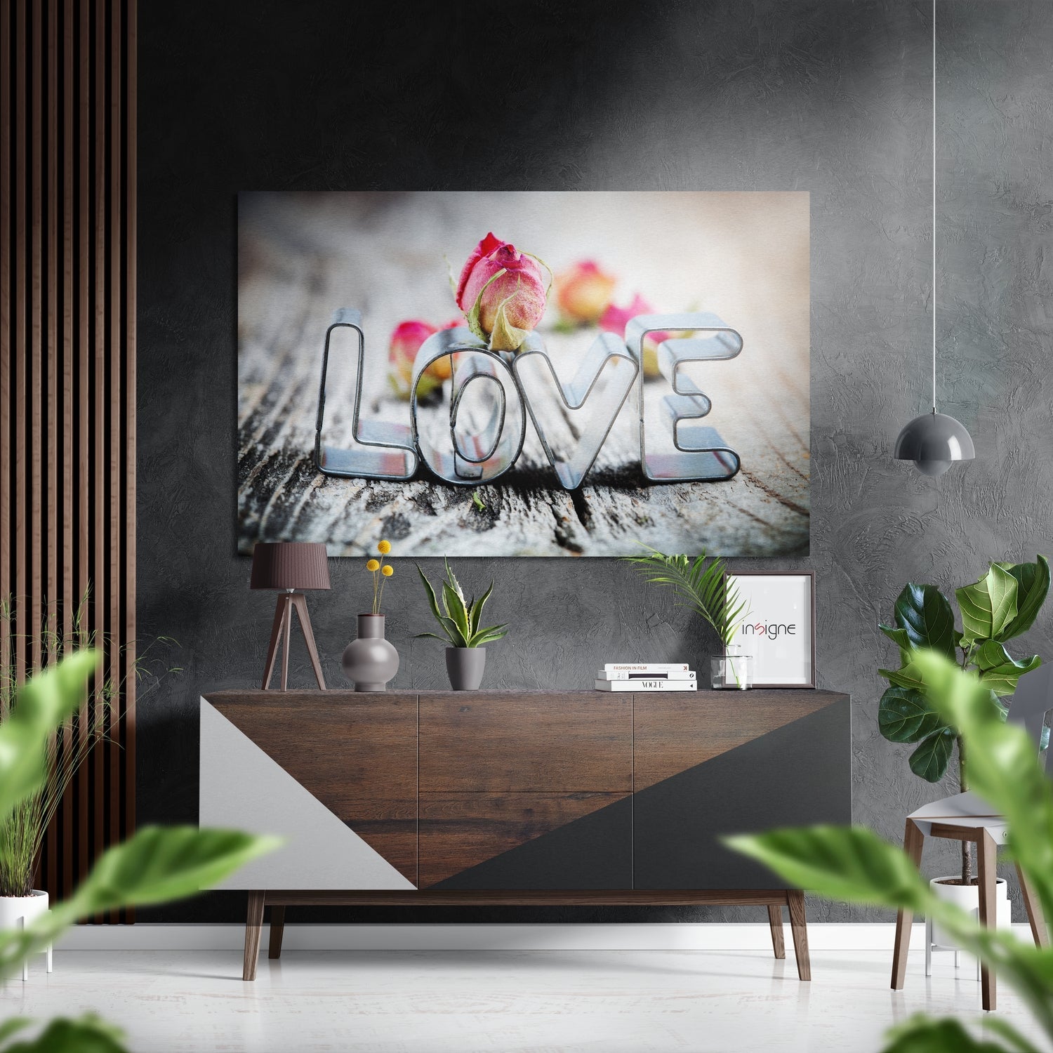 Modern living room interior featuring "LOVE" brushed aluminium wall art with red roses displayed above a wooden console table.