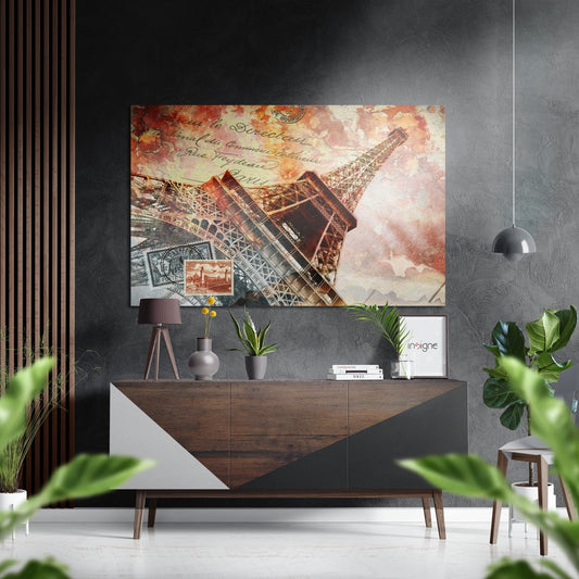 Vintage-style Eiffel Tower wall art in warm sepia and rust tones displayed above a wooden dresser in modern interior setting.