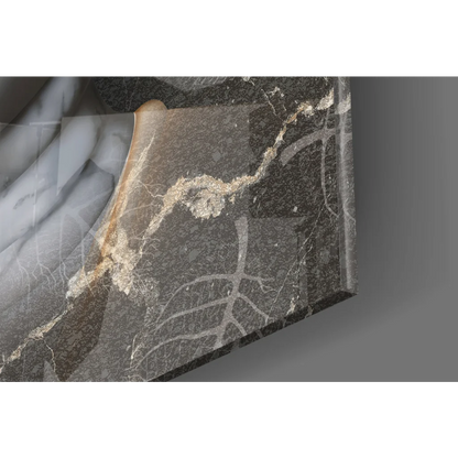 Stunning silver Buddha face glass wall art on dark gray marble slab