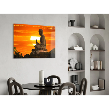 Serene Buddha silhouette in glass wall art against orange sunset