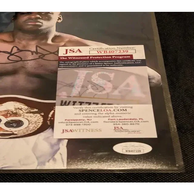 Buster Douglas autographed victory photo with JSA COA for authentic collectible display